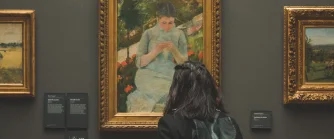 Girl looking at a painting in Musée d'Orsay